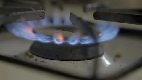 Side view stove fire turned on slow motion close up Stock Footage 163770084