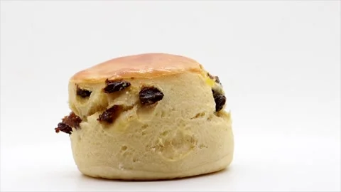 Side View Of A Sultana Scone Rotating On A White Background, UK Stock Footage 153501292