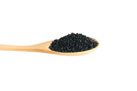 Side view sweet basil seeds on wooden spoon  isolated on white background Stock Photos