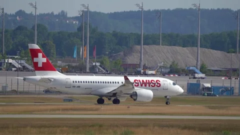 Side view of a Swiss Airlines passenger airplane taxiing on the taxiway Stock Footage 246708965