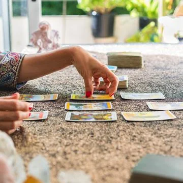 Side view of a tarot reader interpreting the cards 写真素材
