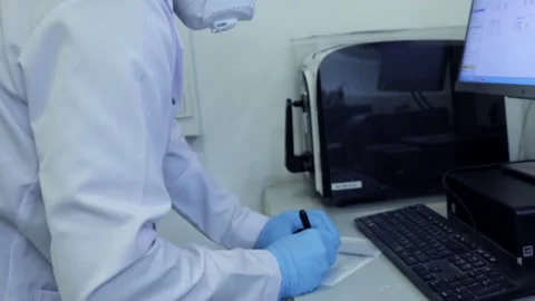 Side View of Technology Engineer Working on Desktop Computers in Office Stock Footage 141799709