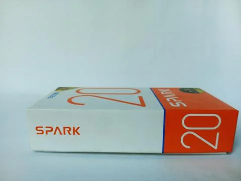 Side view of Tecno Spark 20 phone box. Stock Photos
