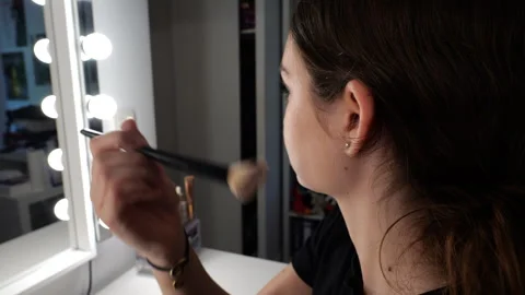 Side View of Teenager Applying Makeup in Front of Vanity Mirror in 50p Stock Footage 338018293