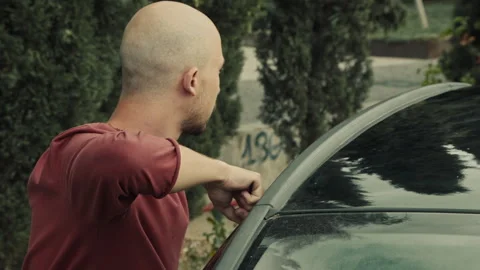 Side view of a Thief entering someone's car Stock Footage 283066096