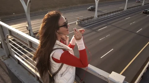 Side view of thoughtful stylish hipster girl in eyeglasses looking away while Stock Footage 111916576
