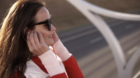 Side view of thoughtful stylish hipster girl in eyeglasses looking away while Stock Footage 112010711