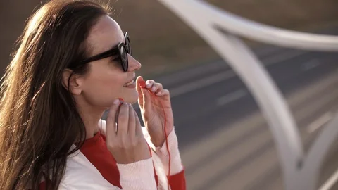 Side view of thoughtful stylish hipster girl in eyeglasses looking away while Stock Footage 112010740