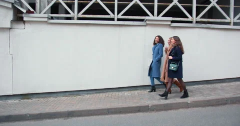 Side view three happy beautiful young business women going out on meeting Stock Footage 144214434