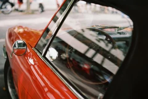 Side view through the window of the interior of a classic car. Stock Photos