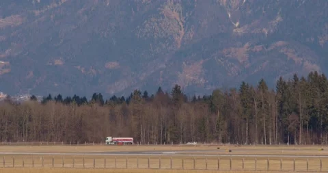 Side view of traffic on countryside road in Slovenia Stock Footage 171883541