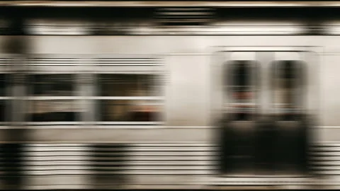 Side view of a train passing by at high speed. Video stock 293950211