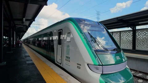 Side view of a Tren Maya train with passengers Stock Footage 343951212