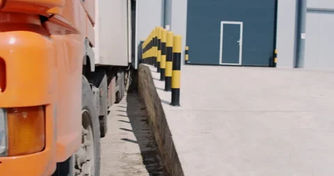 Side view of the truck loading goods into the warehouse Stock Footage 172031312