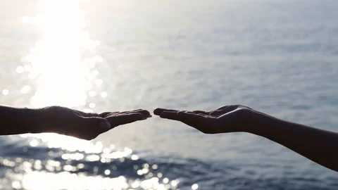 side view of two hands of woman and kid ... | Stock Video | Pond5