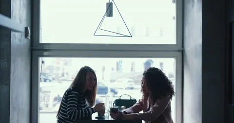 Side view two happy multiethnic business women meeting for lunch, using Stock Footage 144368274