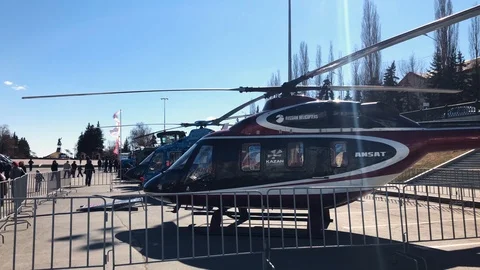 Side view of two helicopters standing in a row at the city exhibition. Stock Footage 106802394