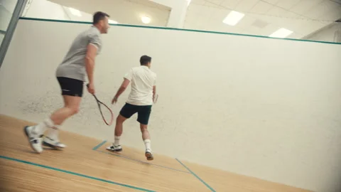 Side view of two squash players Stock Footage 278969375
