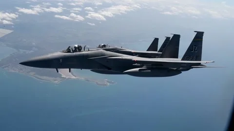 Side view of two U.S. Air National Guard F-15C Eagles flying side by side Stock Footage 201526945