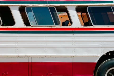 Side view of typical mexican bus parked in small village Stock Photos