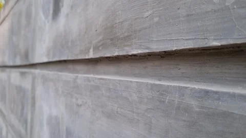 Side view of unfinished concrete wall with reglet or reveal trim. Stock Footage 248127545