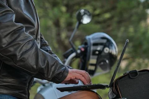 Side view of an unrecognizable man using a laptop while traveling Stock Photos