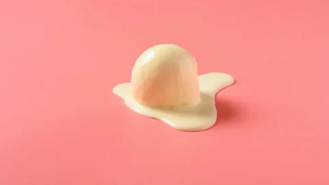 Side view vanilla flavor ice cream ball melting timelapse on pink background Stock Footage 139333797