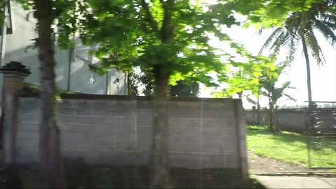 Side View, Vehicle Shot, Driving on the road, Bali, Indonesia Stock Footage 252486261