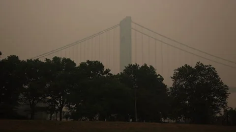 Side View Verrazano Bridge Engulfed in Smoke from Canadian Wildfires Stock Footage 243228586