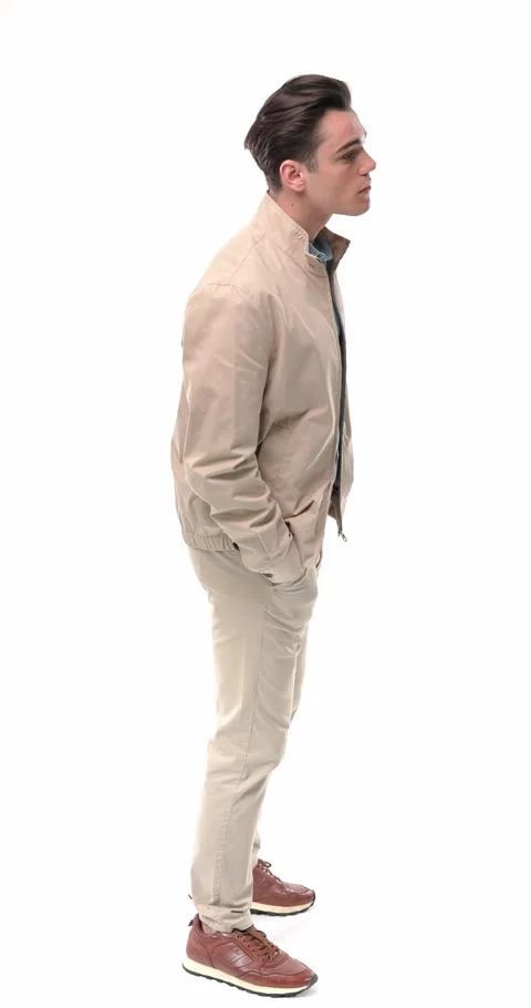 Side view video of attractive young man in beige outfit standing in line, Stock Footage 304829915