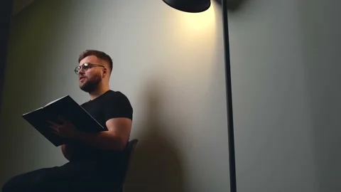 Side view video of a caucasian man with beard and glasses explaining something Stock Footage 155372623