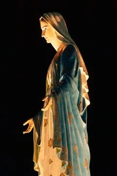 Side view of the Virgin Mary statue at night. Stock Photos