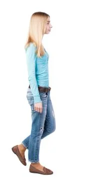Side view of walking  woman in jeans Stock-Fotos