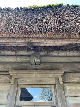 Side view of the wall of a log peasant house Stock Photos