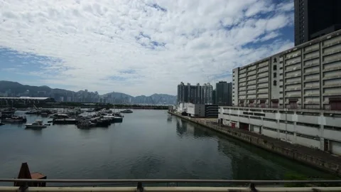 Side view while riding on bus along Kwun Tong Bypass in the morning PartCD Stock Footage 228049769
