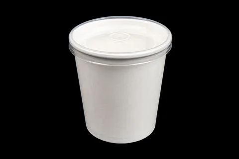 Side view white empty disposable paper cup isolated on black background. Pape Stock Photos