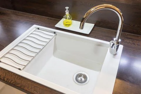 Side view of the white empty  kitchen sink. Stock Photos