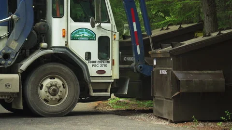 Side view of white garbage truck picking... | Stock Video | Pond5