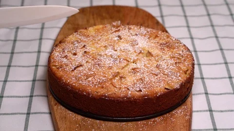 Side view White knife cuts piece of homemade cake Stock Footage 126901446