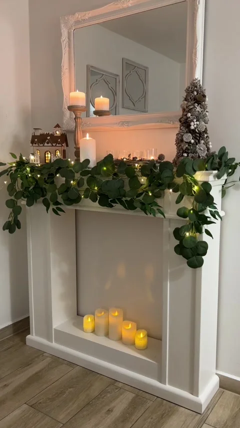 Side view of white wooden fireplace mantel with Christmas decorations Stock Footage 341773542