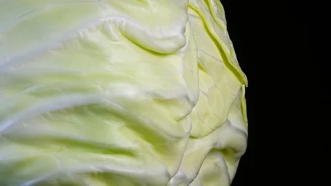 Side view of whole white cabbage head close up, rotating contra clockwise Stock Footage 78349263