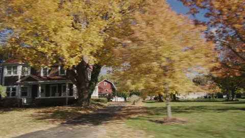 Side View from the window of a car that drives through a typical American suburb Stock Footage 203717953
