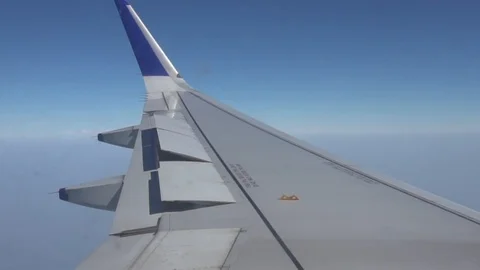 Side view of the wing of a plane with it... | Stock Video | Pond5