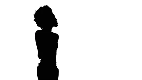 Side view of a woman dancing, moving her hands and body, showing Come Here sign Stock Footage 132882976