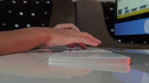 Side view of woman hand using computer keyboard at desk, working on PC in modern Stock Footage 333767801