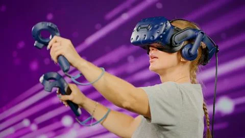The side view woman in modern virtual reality paint and fly. The woman wearing Stock Photos