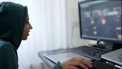 Side view woman programmer freelancer hacker in hoodie working using computer Stock Footage 123287695