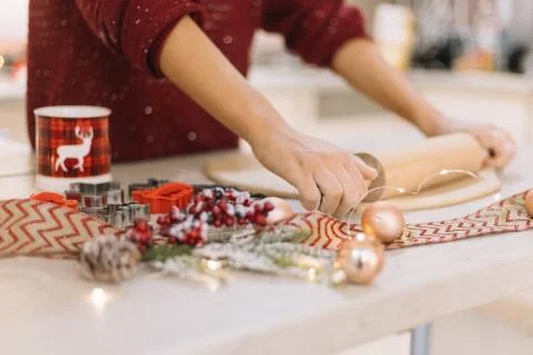 Side view of womans hands rolling cookie dough Stock Photos