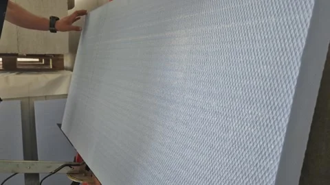Side View of Worker Cutting XPS Foam Board With Hot Wire Cutter Stock Footage 340643671