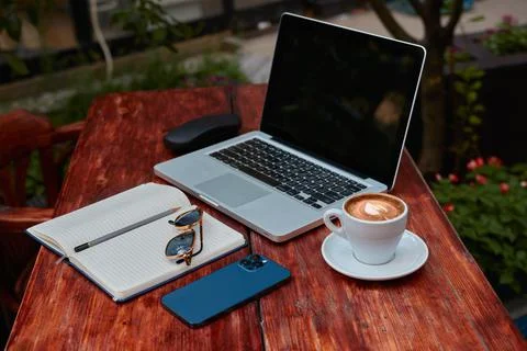 Side view of a workspace in a cafe Stock Photos